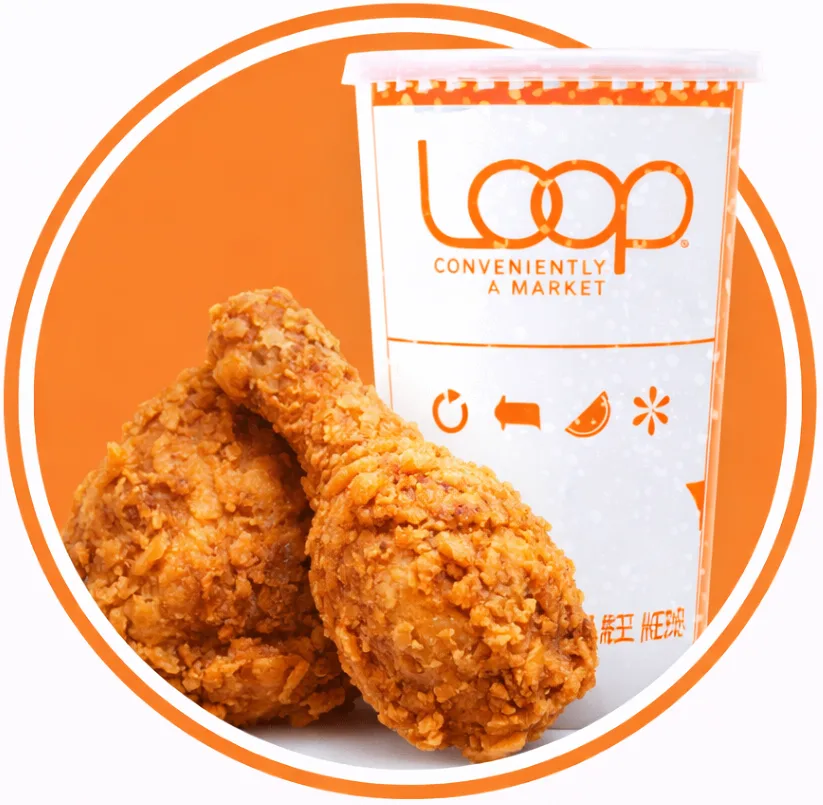 Two pieces of fried chicken in front of a Loop cup